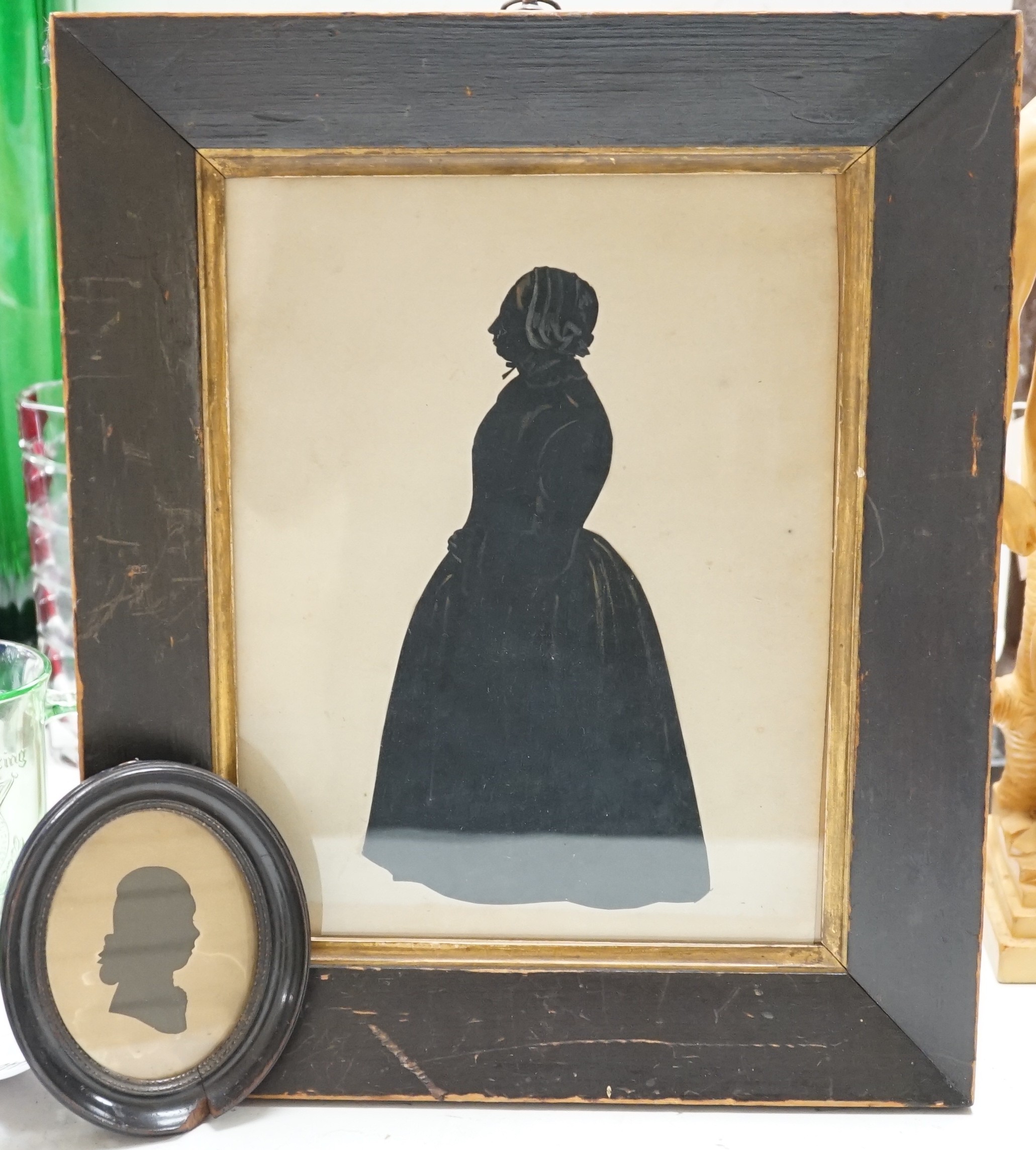 An oval silhouette dated on reverse 1777 together with a larger later silhouette-25cms high x 19cms wide